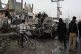 ‘DESTROYING TO REPLACE’: Palestinians inspect a vehicle struck by an Israeli air strike in the Maghazi refugee camp in the central Gaza Strip