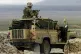 CONSTRAINED ROLE? British marines on patrol at Camp Taylor, the forward operating base, as more than 1,000 troops began Operation Snipe in the south-east region of Afghanistan, 2002