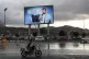 Vehicles pass under a banner showing Houthi leader Abdul Malik al-Houthi, in Sanaa, Yemen, March 31, 2026