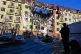 A rescue worker walks in front of residential building which was heavily damaged after a Russian strike in Odesa, Ukraine, April 6, 2026