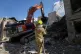 An excavator removes rubble at the site of a strike that, according to a security official at the scene, destroyed half of the Khorasaniha Synagogue and nearby residential buildings in Tehran, Iran, April 7, 2026