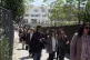 People leave a courthouse after a gunman opened fire leaving several people wounded in Athens, April 28, 2026