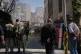 Bystanders watch from a distance as rescue teams and first responders work at the site of a strike that, according to a security official at the scene, destroyed half of the Khorasaniha Synagogue and nearby residential buildings in Tehran, Iran, April 7, 2026
