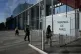 People walks in front of the Paris courthouse, in Paris, France, April 20, 2026