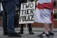 Two tier policing sign