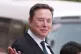 Elon Musk departs after a welcome ceremony with President Donald Trump and China's President Xi Jinping at the Great Hall of the People, May 14, 2026, in Beijing