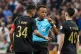Referee Omar Artan, center, of Somalia, is confronted by players after calling a penalty kick during the CAF Champions League final soccer match between AS FAR Rabat and Mamelodi Sundowns, in Rabat, Morocco, May 24, 2026