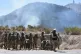 Military police clear a highway blocked by anti-government protesters in Llavini, Bolivia, June 21, 2026