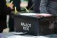 A ballot box arrives as polls close and counting begins at Rochdale Leisure Centre