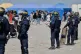 Police conduct a search operation at a makeshift camp of migrants who want to cross the English Channel to Britain near Dunkirk, northern France, May 27, 2026