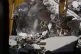A rescue worker searches for victims under the rubble of a building that was hit Monday in an Israeli airstrike in the southern port city of Tyre, Lebanon, June 2, 2026
