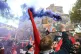 A demonstrator releases a smoke flare in front of a mural on Cable Street in the East End of London, which commemorates the Battle of Cable Street