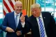 President Donald Trump holds up a red card during a meeting with FIFA president Gianni Infantino in the Oval Office of the White House, Tuesday, Aug. 28, 2018