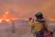 This image made from video provided by INFOCA shows firefighters battling a wildfire near Los Gallardos, Almeria, Spain, on Thursday, July 9, 2026