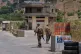 Lebanese army soldiers stand at a checkpoint in Froun village, southern Lebanon