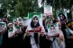 Shiite Muslims hold portraits of schoolchildren killed in a strike on a school in the southern Iranian town of Minab on Feb. 28 as they express solidarity with Iran in Magam, north of Srinagar in Indian-controlled Kashmir