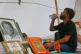 Abhijeet Dipke, founder of the Cockroach Janta Party, drinks water as he sits by a portrait of hunger-striking activist Sonam Wangchuk during a protest in New Delhi, India, July 21, 2026