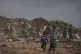 Palestinians search for reusable items at a landfill in Deir al-Balah, in the central Gaza Strip, July 23, 2026