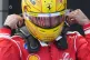 Ferrari driver Lewis Hamilton of Britain adjusts his helmet after the qualifying session ahead of Sunday's Formula One Hungarian Grand Prix auto race, at the Hungaroring racetrack in Mogyorod, near Budapest, Hungary, Saturday, July 25, 2026