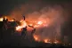 Firefighters tackle a wildfire on Winter Hill near Bolton