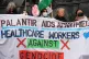 NHS staff blockade the entrance to NHS England's headquarters in central London demanding the cancellation of its contract with Palantir, which campaign groups say supplies advanced technology to Israel's military, April 3, 2024