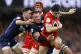 Wales' Louis Rees-Zammit (right) is tackled by Scotland's Ben White (left) and Matt Fagerson (centre) during the Guinness Men's Six Nations match at the Principality Stadium, Cardiff. Picture date: Saturday February 21, 2026