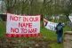 Protesters hang banners outside RAF Fairford in Gloucestershire during a demonstration to oppose any use of the base by US bombers, March 7, 2026