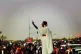 Alaa Salah, a Sudanese student, standing on a car in the 201