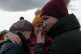 Ukrainian refugees cry as they reunite at the Medyka border 