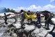 Villagers carry the body of a victim following earthquakes a