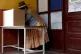 A woman stands at the voting booth during general elections 