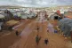 Syrian refugees walk through a camp near the village of Kafr