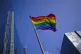 A rainbow flag flutters in the wind at the financial quarter