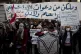 Protesters participate in a march against the political lead