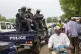Malian police gather outside the Bourse du Travail where str