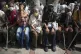 Seniors sit next to a basketball court in the 23 de Enero ne