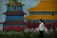A woman walking in Beijing, China. President Xi Jinping is r