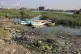 Fishing boats sit in the Shatt al-Arab waterway in Basra, Ir