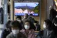 A TV screen showing a news program reporting about North Kor