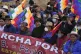 Bolivia's former President Evo Morales (centre) waves as he 