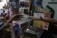 Rim Hassam gives change in US currency to a customer in Cara