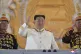 North Korean leader Kim Jong Un (centre) watches a military 