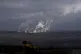Steam and smoke rise from power plant located by the Turow l
