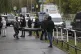 Funeral workers carry a body of victim at the scene of a sho