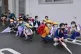 Primary school students find shelter near a building on thei