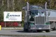 A transport truck is seen leaving from the main gate at the 