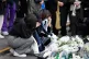 Women pray for victims of a deadly accident following Saturd