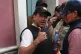 Luis Fernando Camacho gives a thumbs up outside the presiden