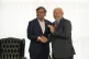 Brazilian President Luiz Inacio Lula da Silva, right, shakes