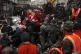 Civil defence workers and security forces carry an earthquak